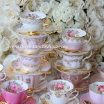 A Pink & Gold Tea Station with Gold Plated Teaspoons