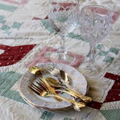 Vintage Picnic Rug, cake plates, wine glasses and gold cutlery
